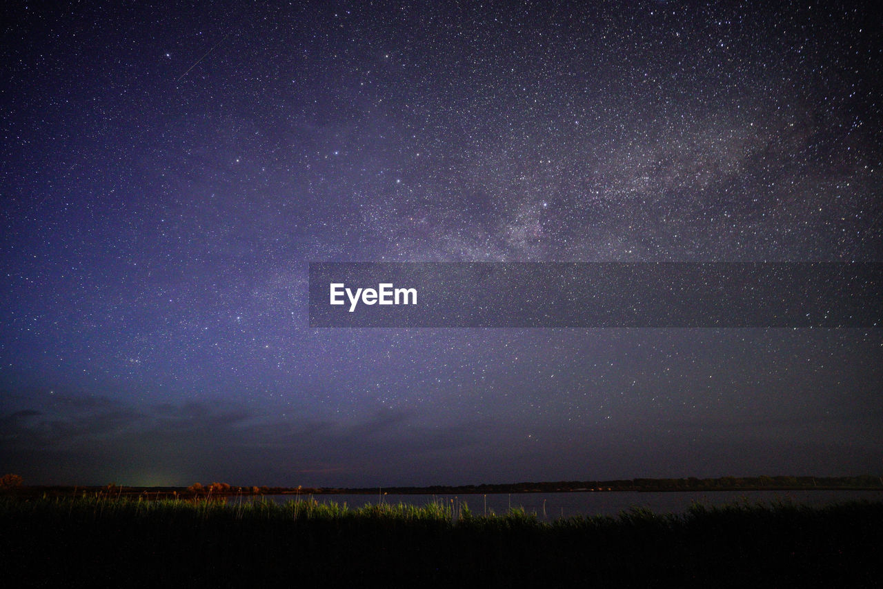 Scenic view of star field against sky at night