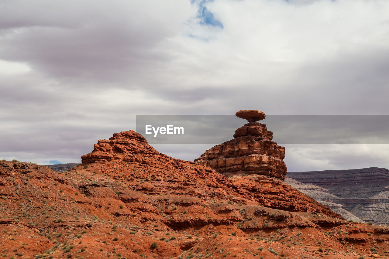 Rock formations on mountain against sky