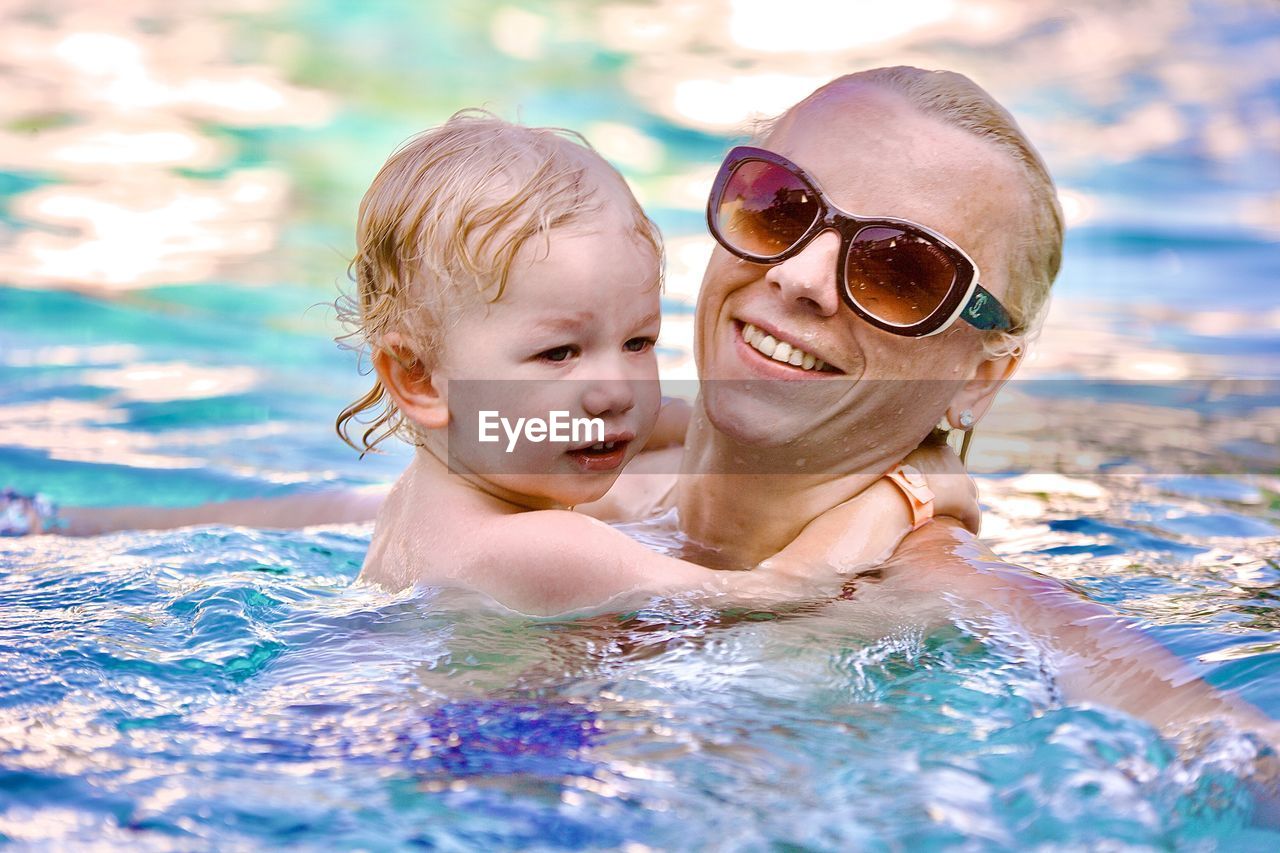 Portrait of woman swimming in pool