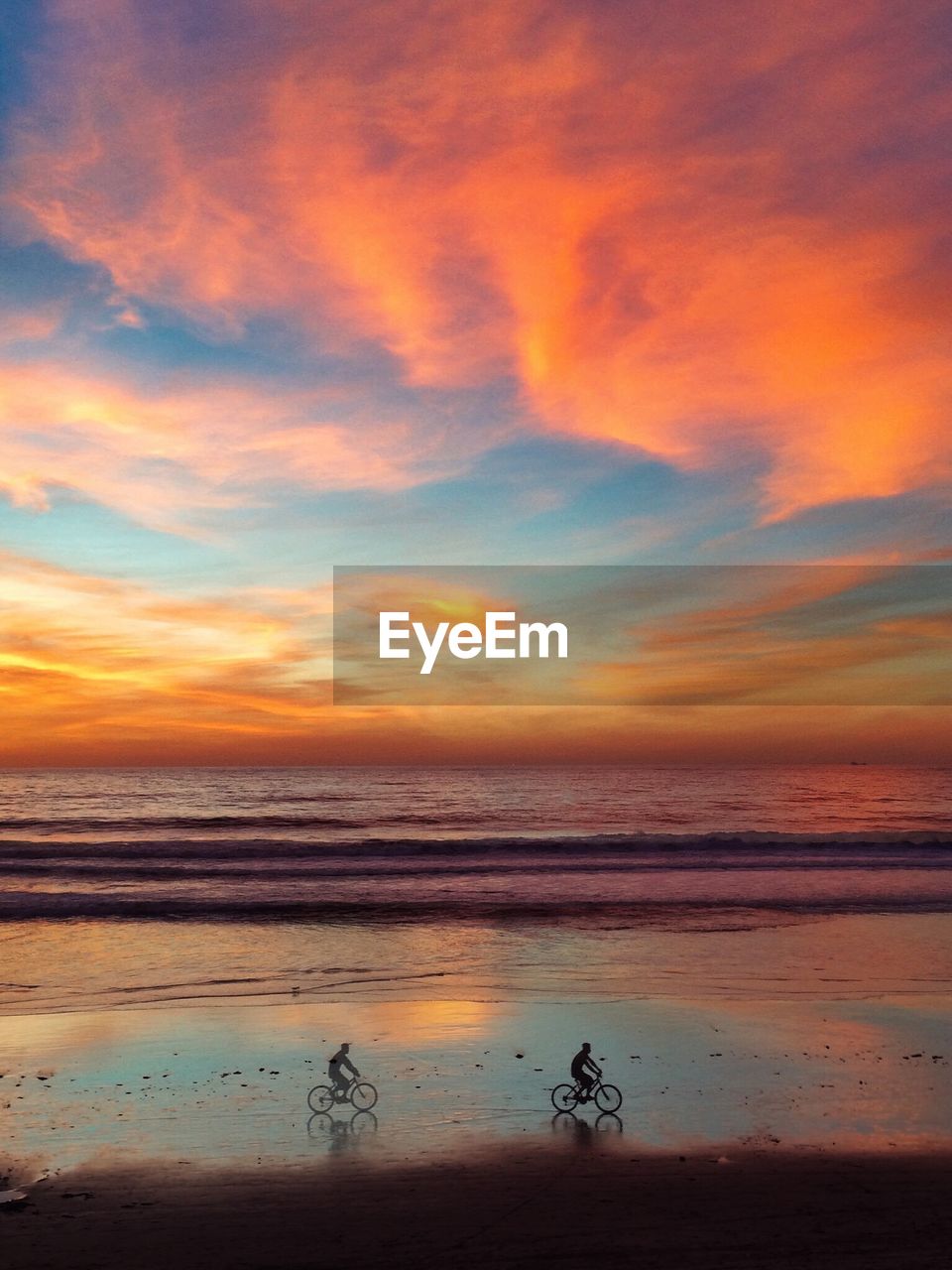 People on beach at sunset