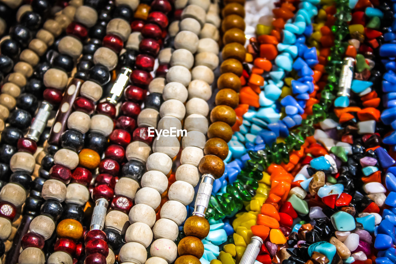 Close-up of multi colored jewelry for sale