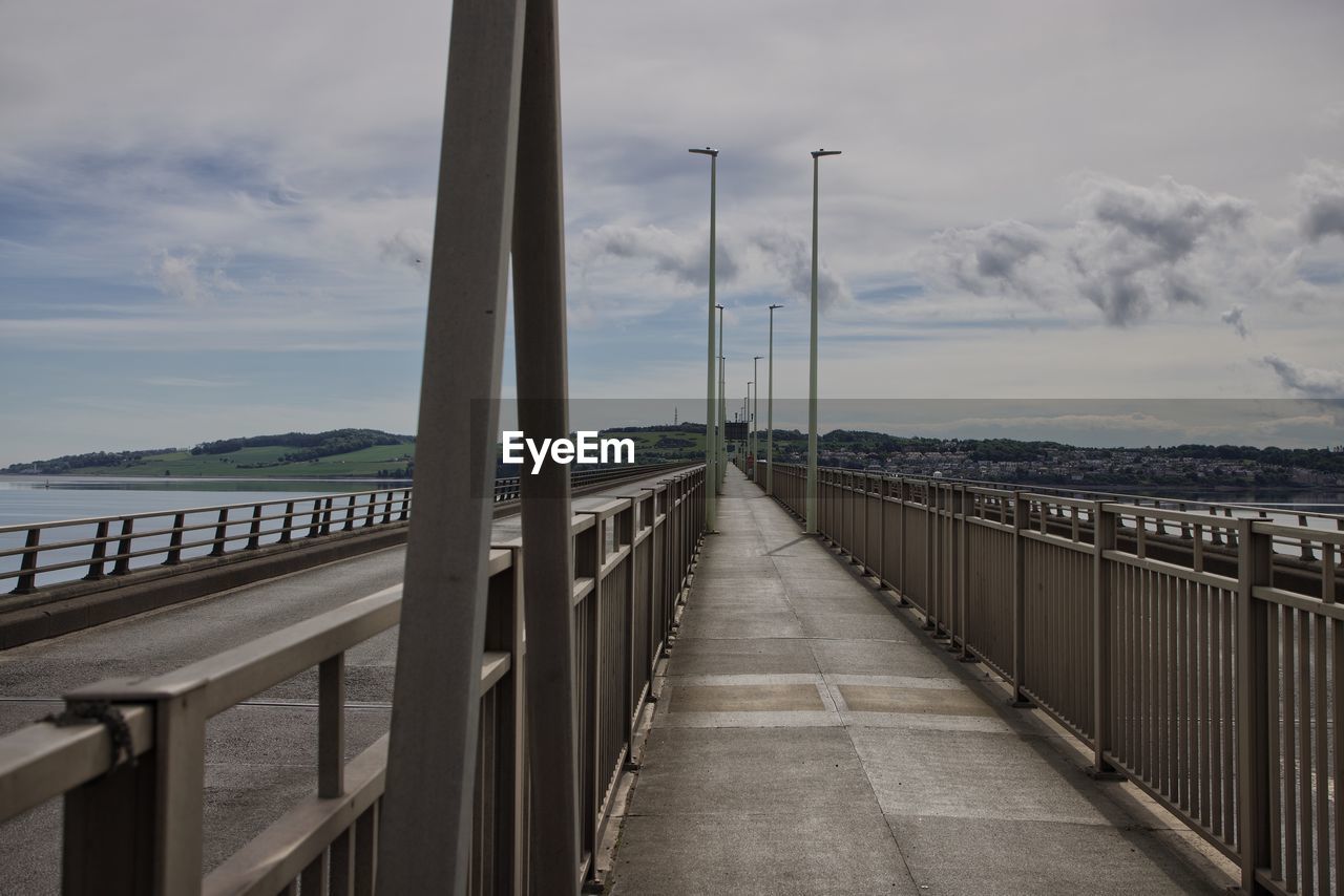 Diminishing view of bridge across river