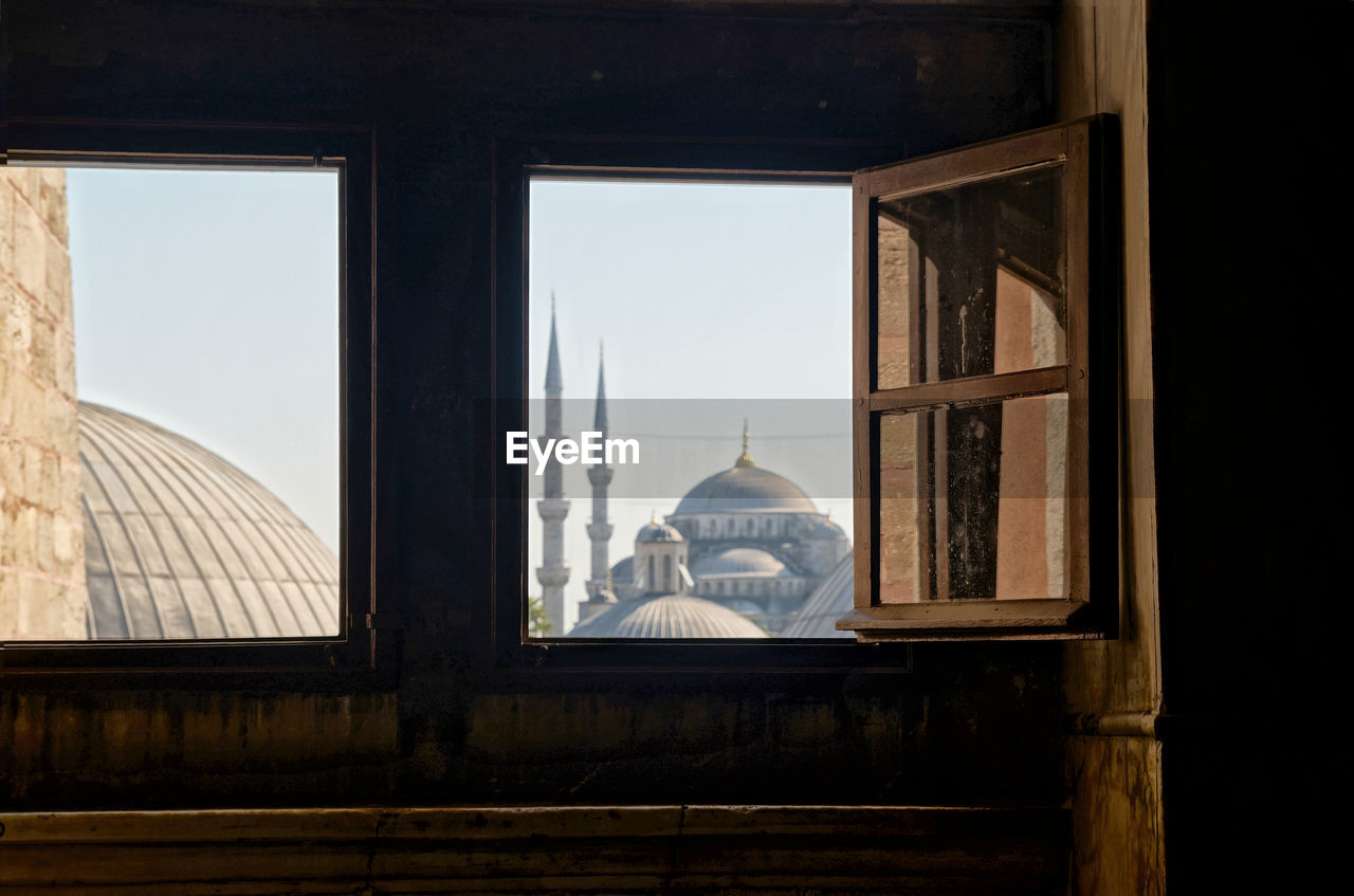 Blue mosque in istanbul seen through an open window