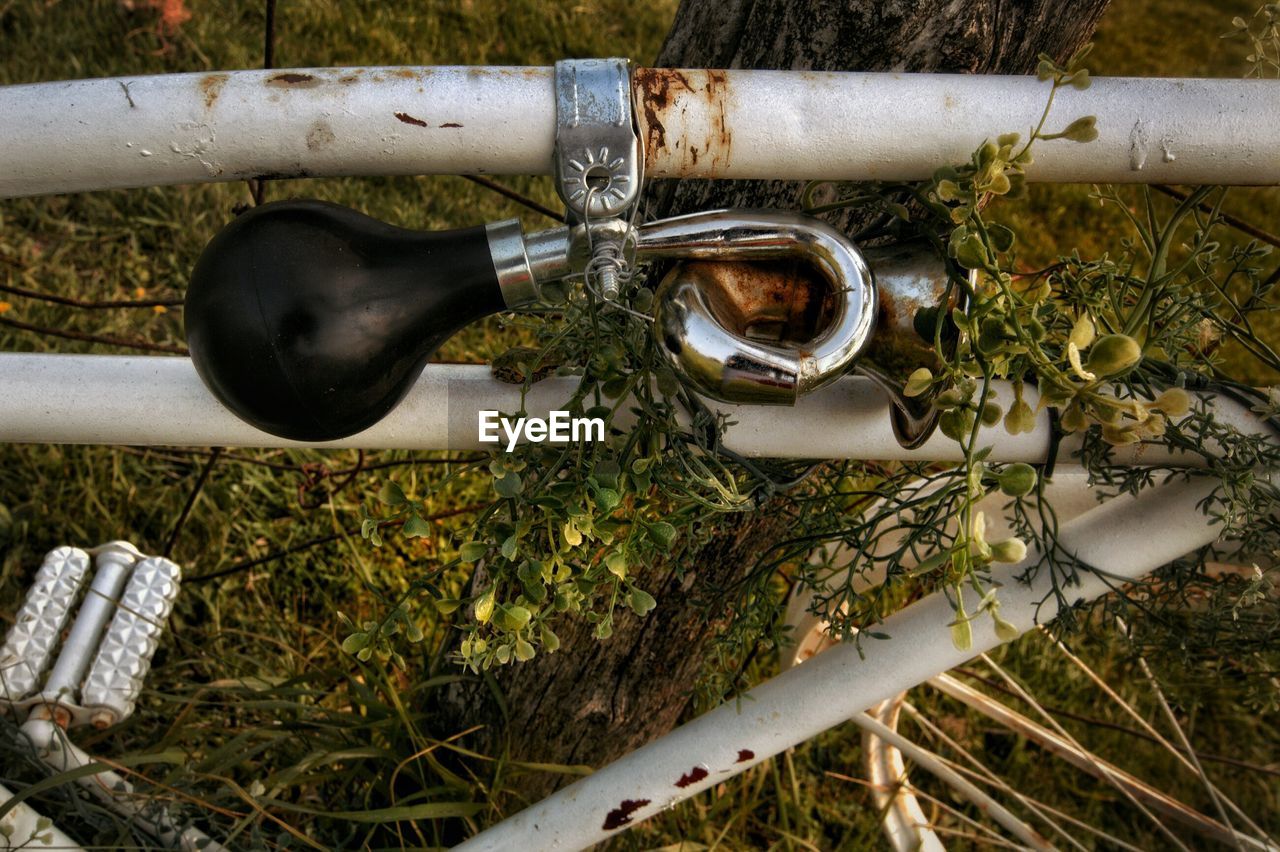 HIGH ANGLE VIEW OF BICYCLE BY TREE