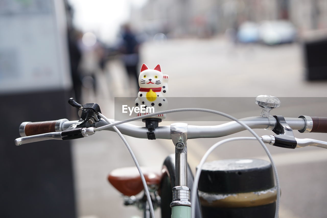 Close-up of bicycle in basket on street