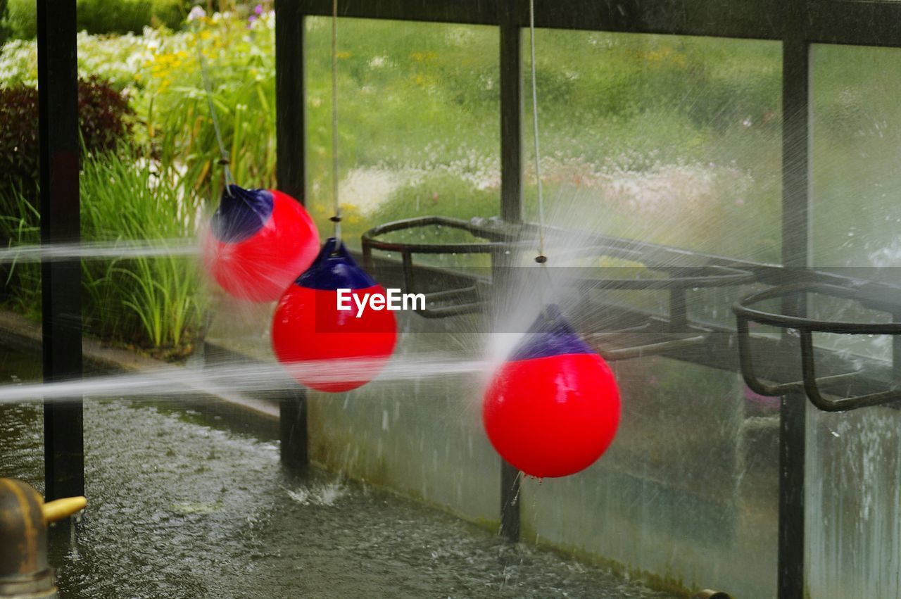 Blurred motion of person seen through wet window