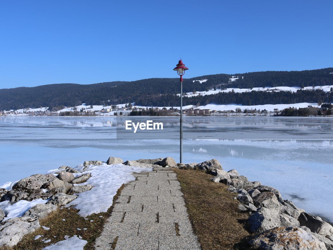 Scenic view of sea against clear sky during winter