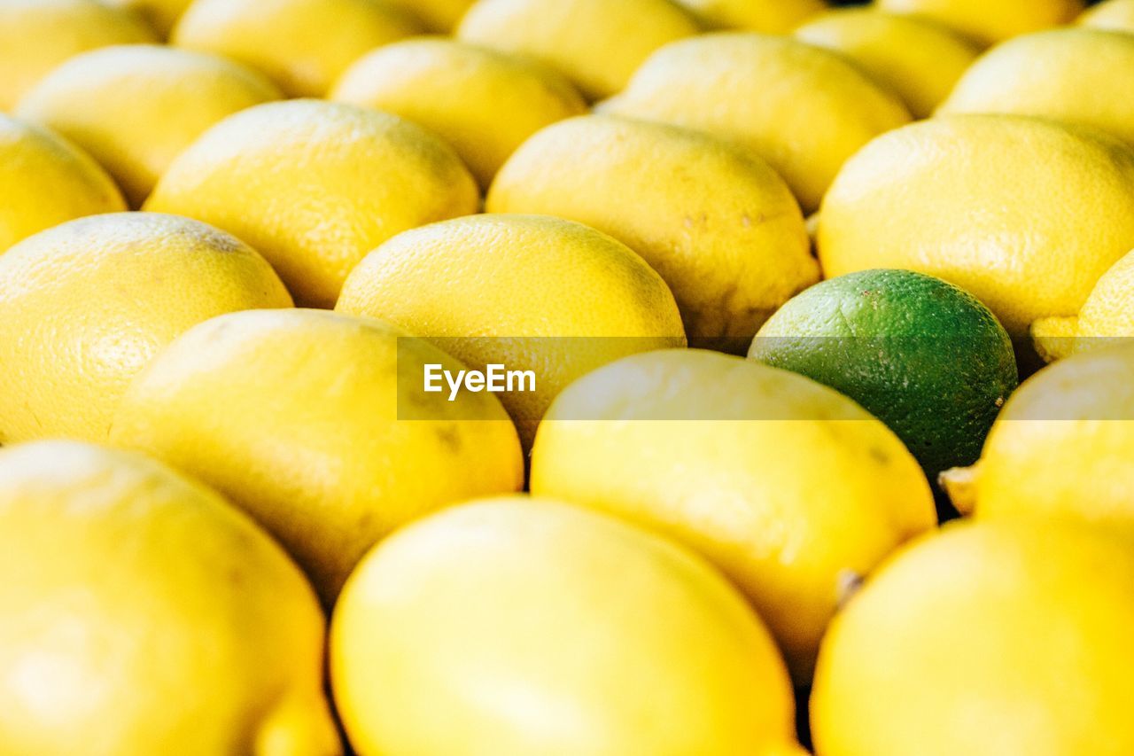 Full frame shot of lemons at market stall