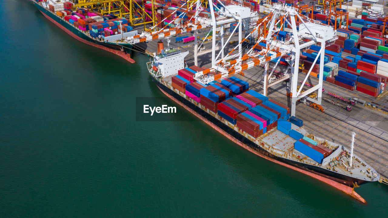 Aerial view container ship at commercial dock, company import export global business trade logistic