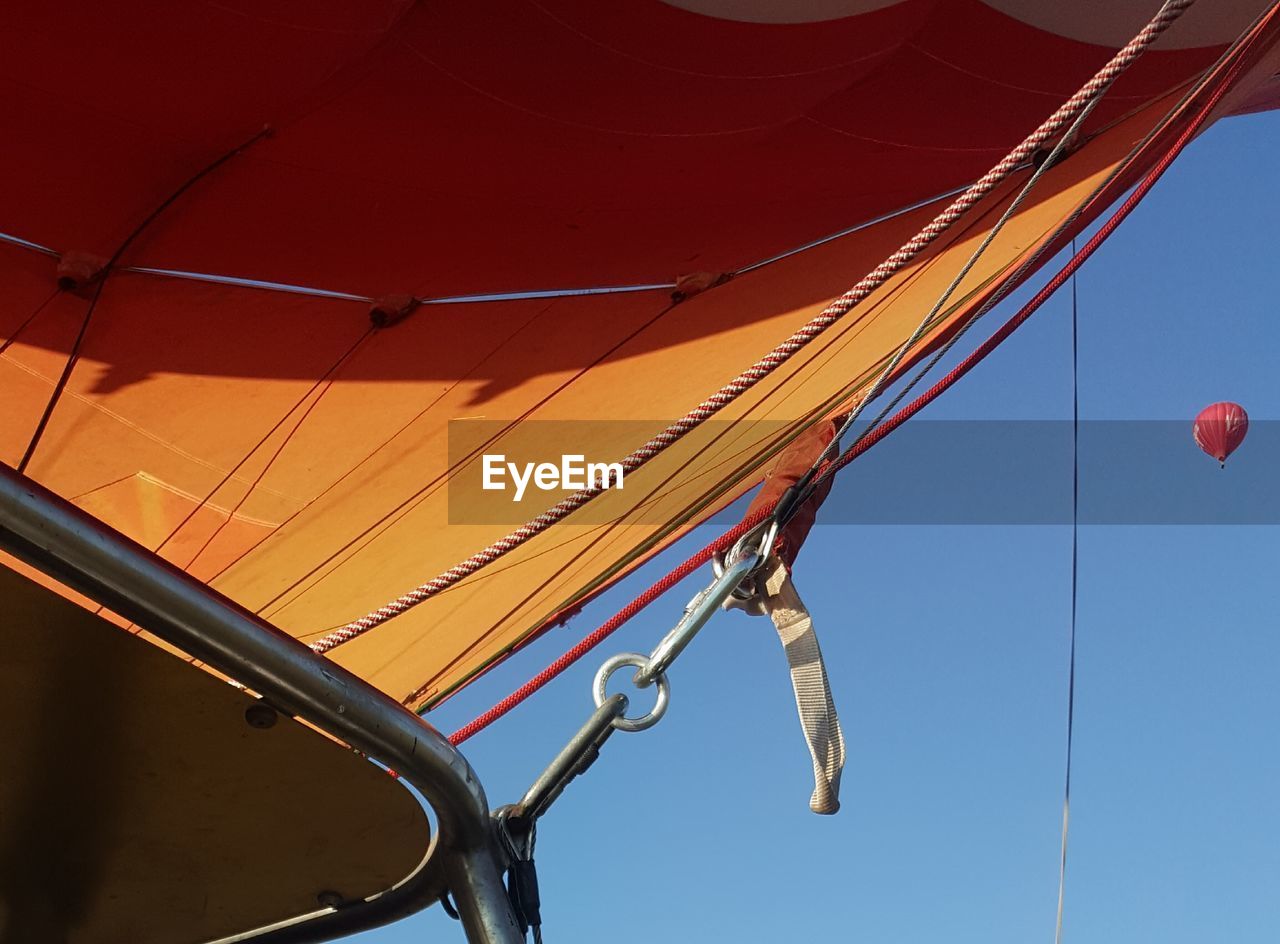 Low angle view of hot air balloon against clear sky