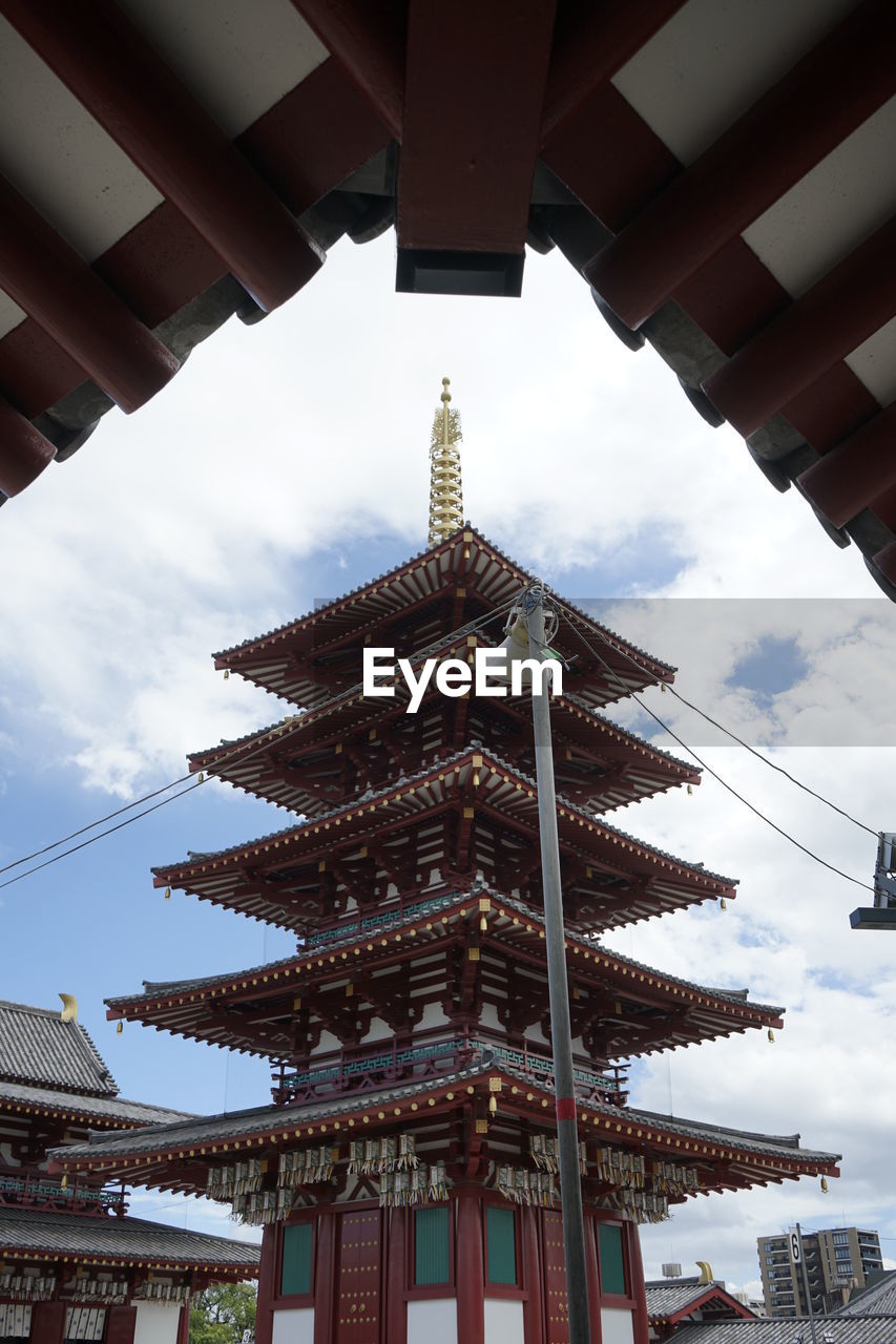 LOW ANGLE VIEW OF PAGODA AGAINST SKY IN CITY