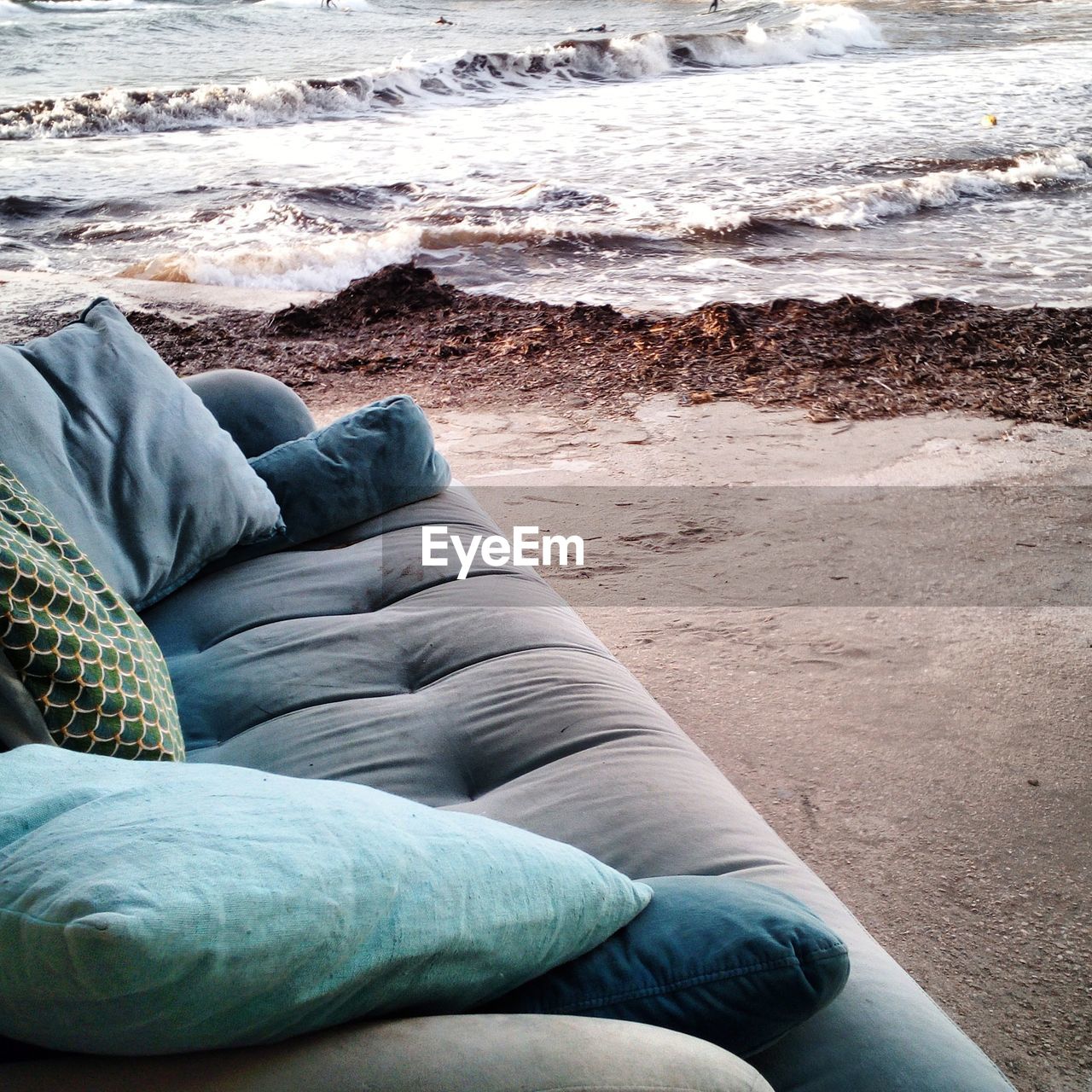 Abandoned sofa on beach