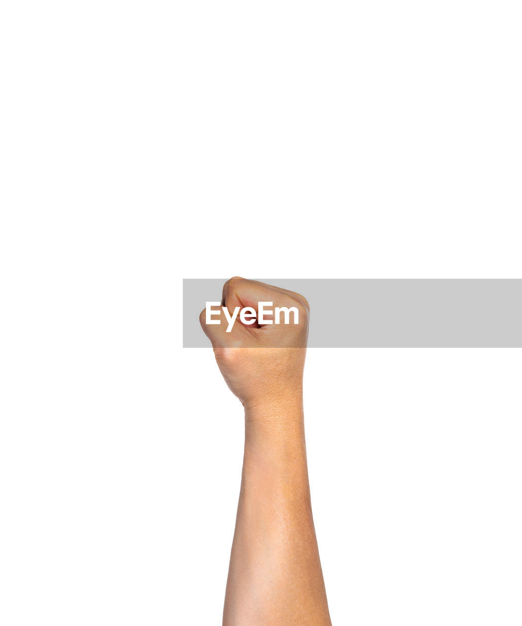 Close-up of cropped hand clenching fist against white background