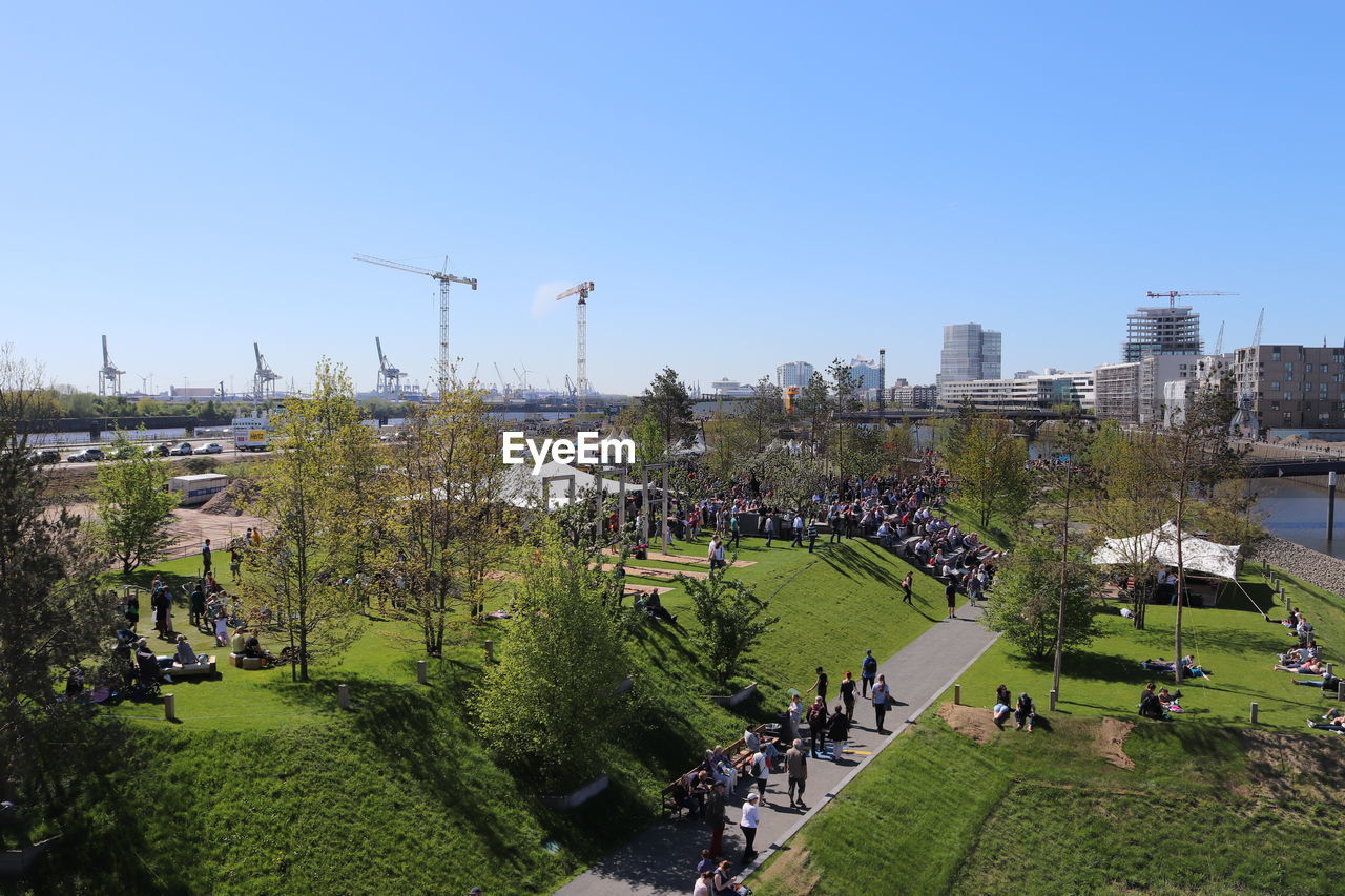 HIGH ANGLE VIEW OF TREES IN PARK AGAINST SKY