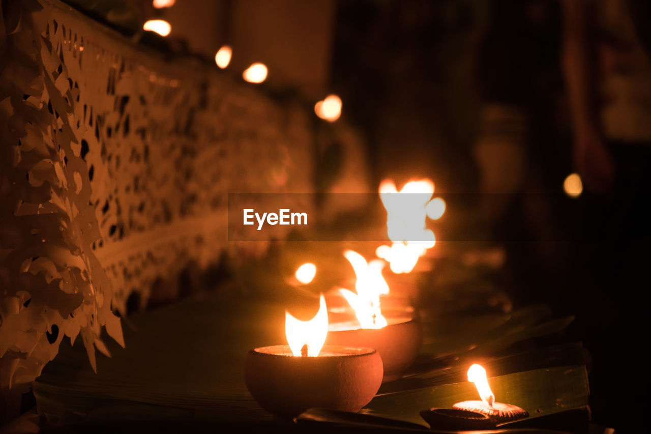 Close-up of diya at night