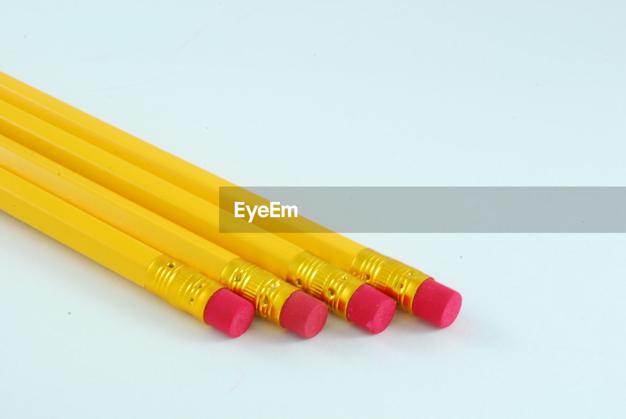 Close-up of pencils on white background