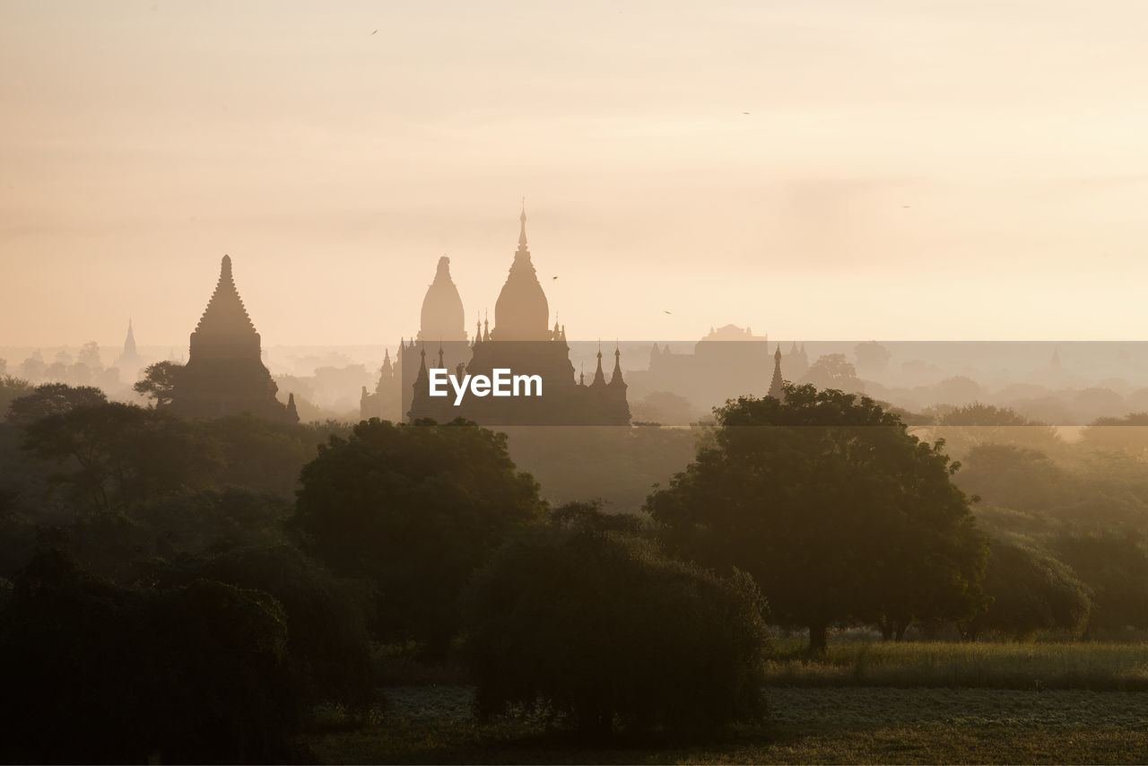 View of historic building against sky during sunset, bagan