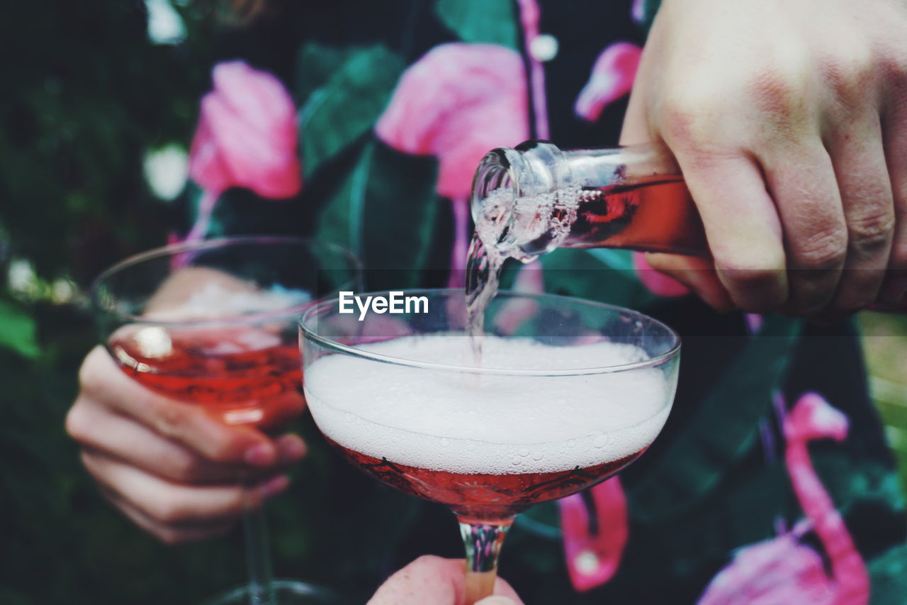 Serving rosé wine at a garden party