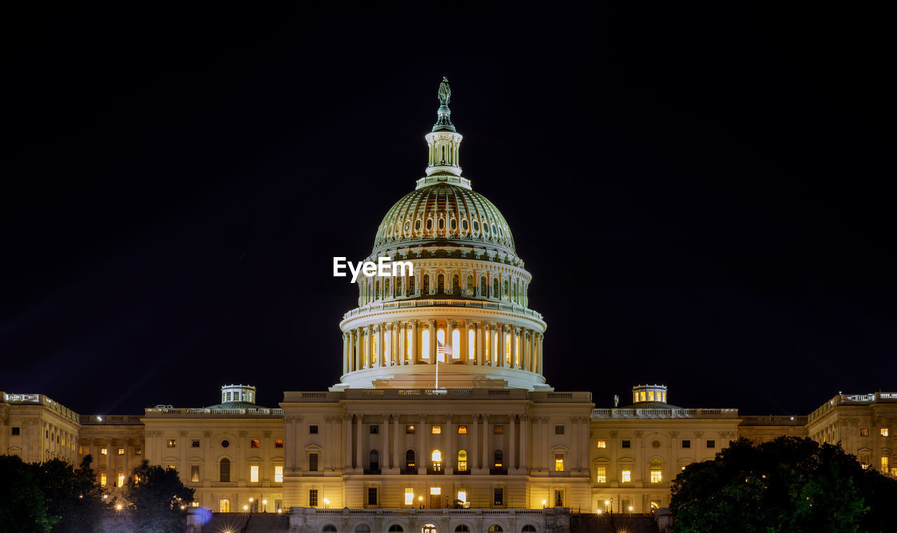 VIEW OF ILLUMINATED TOWER AT NIGHT