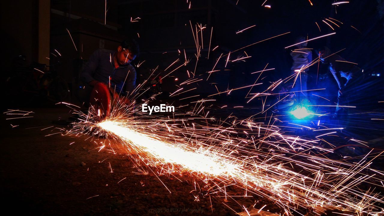 Worker welding at factory