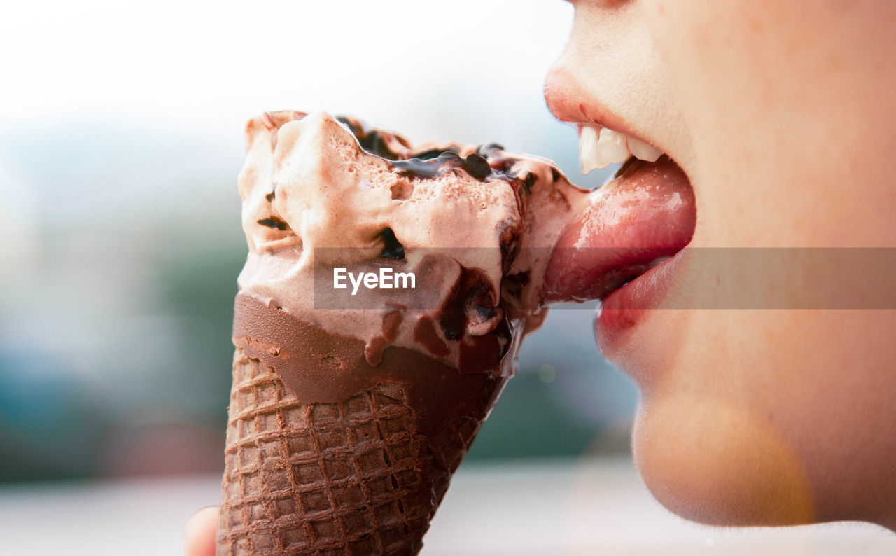 Close-up of woman eating ice cream 