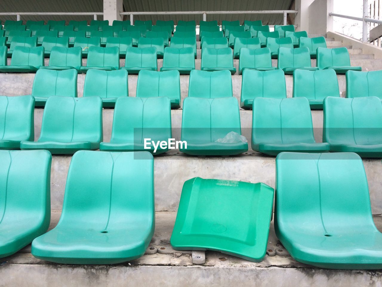 Empty chairs in row at stadium