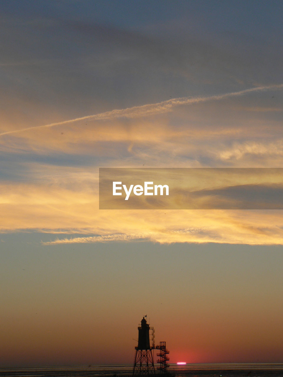 SILHOUETTE SHIP IN SEA AGAINST SKY DURING SUNSET