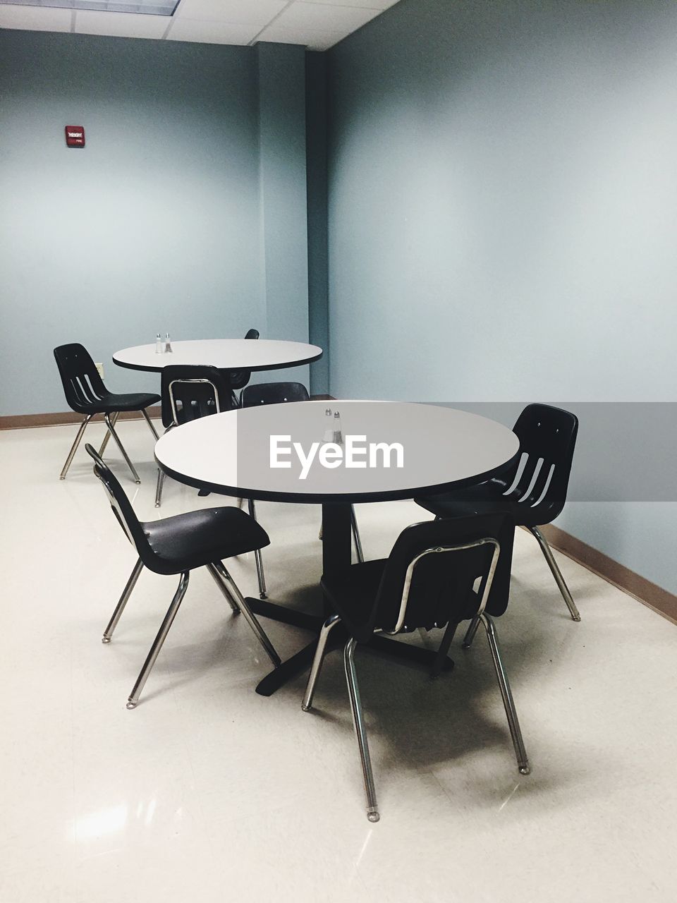 Empty chairs and tables at restaurant