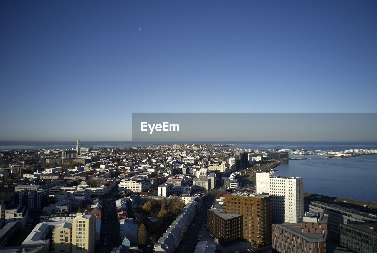 Coastal city under blue sky in sunny day