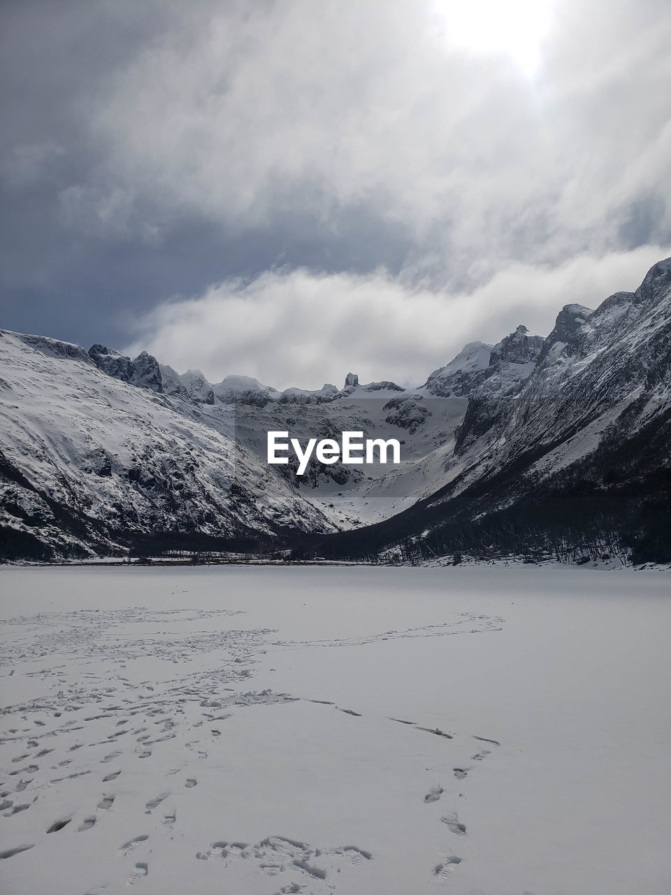 Scenic view of snow covered mountains against sky