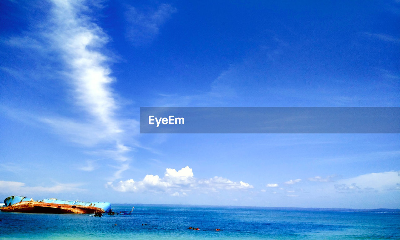 PANORAMIC VIEW OF SEA AGAINST BLUE SKY