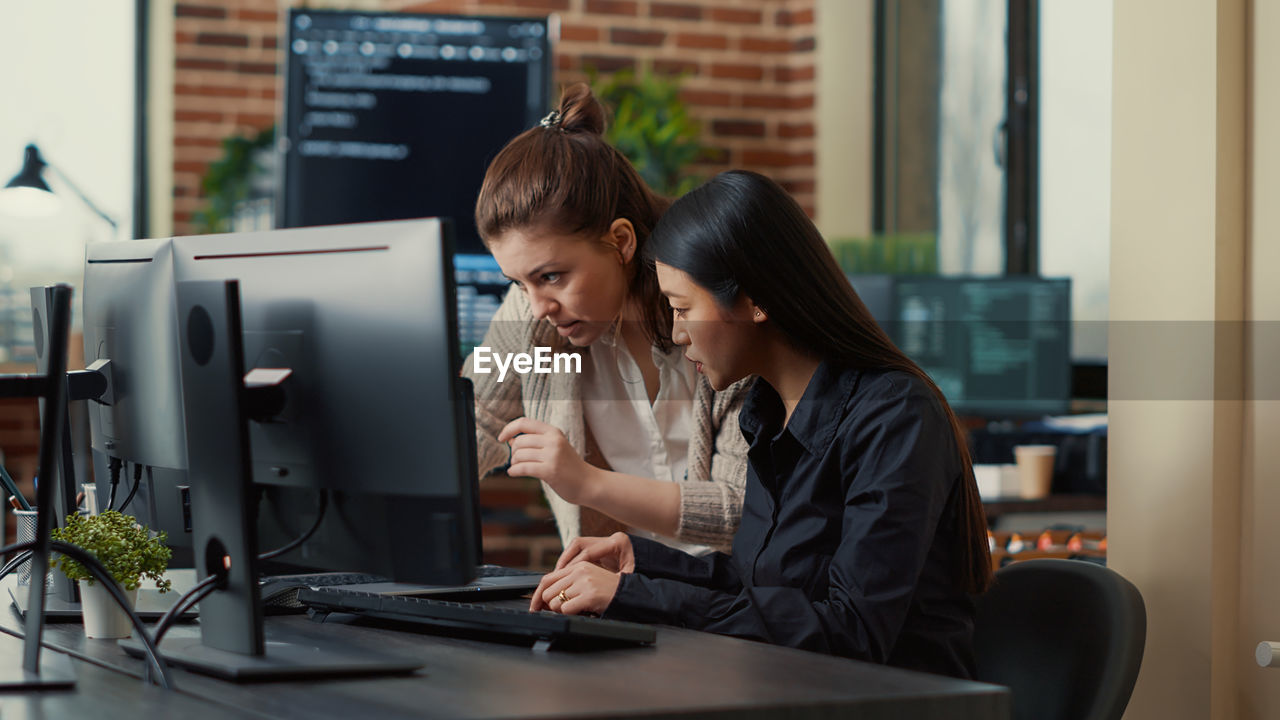 Businesswomen brainstorming in office