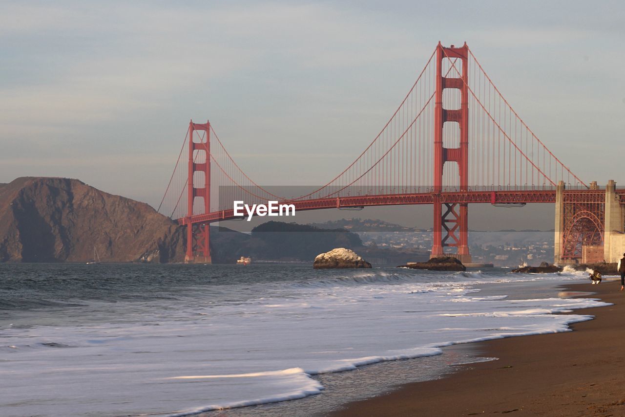 Golden gate bridge over bay against sky