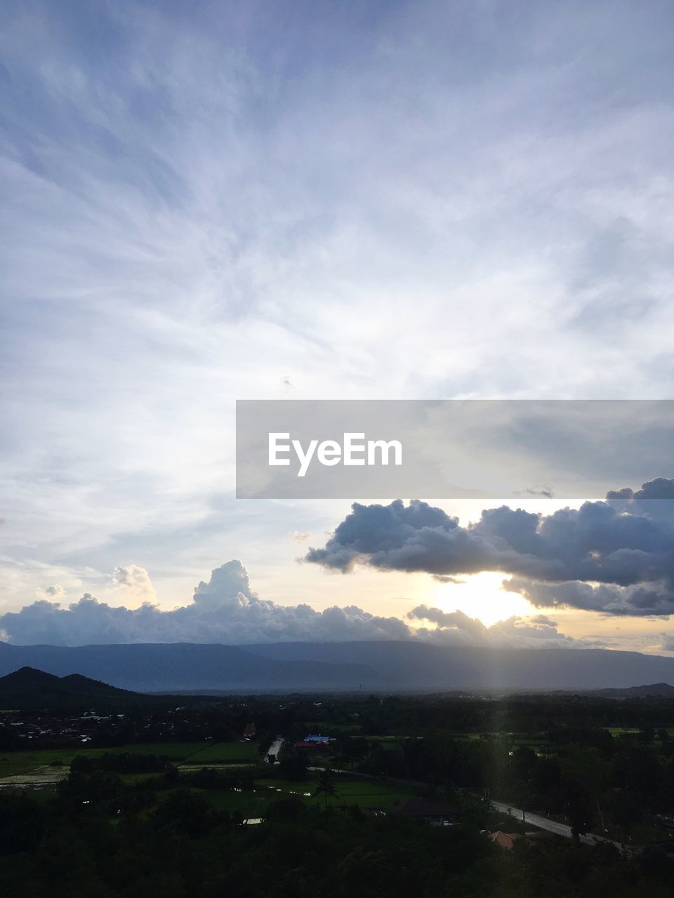 SCENIC VIEW OF MOUNTAINS AGAINST SKY AT SUNSET