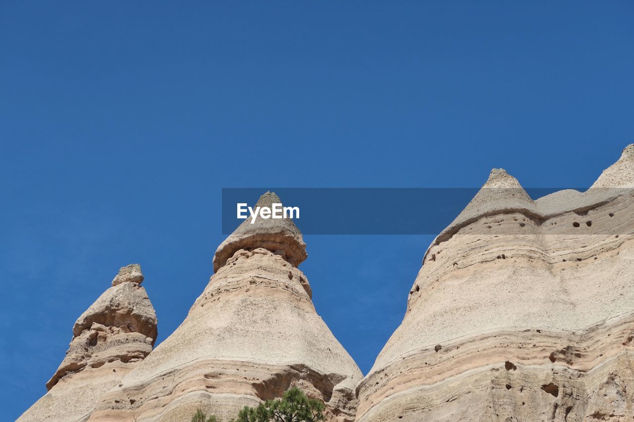 Low angle landscape of triangular rock formations in kasha-katuwe tent rocks national monument