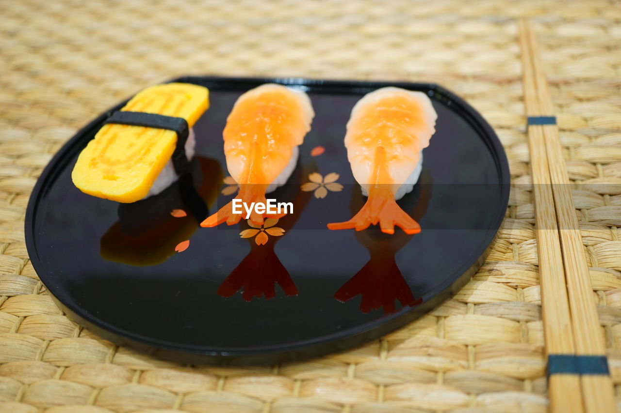 High angle view of fruits in plate on table