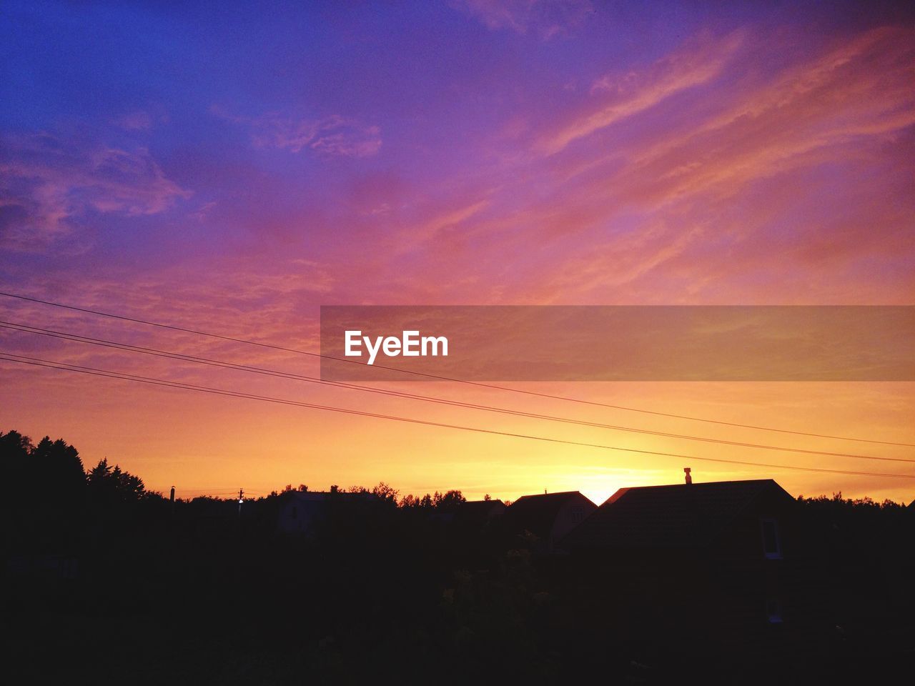 Scenic view of silhouette landscape against sky at sunset