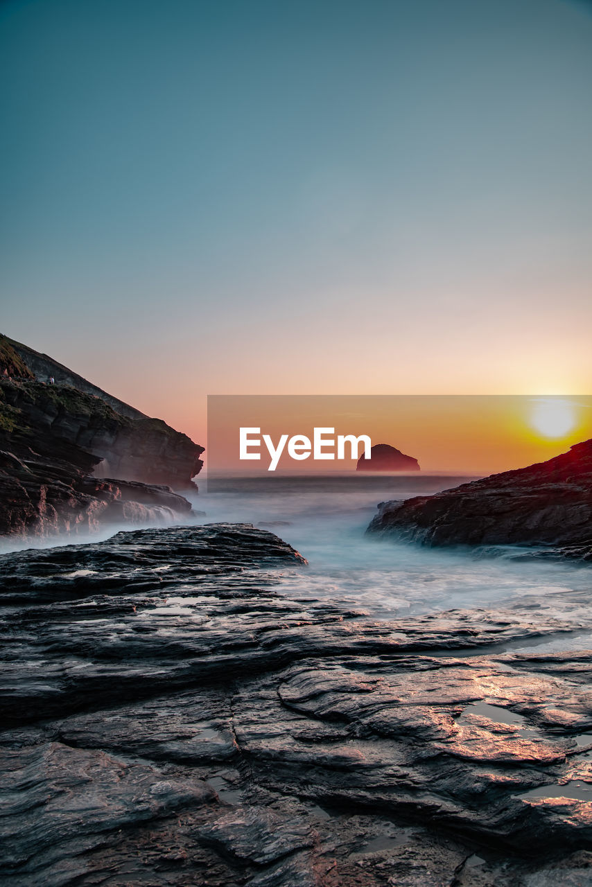 Scenic view of sea against sky during sunset