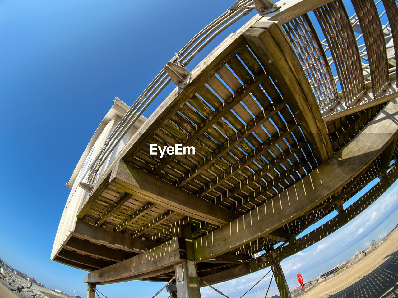 Low angle view of modern building against clear blue sky