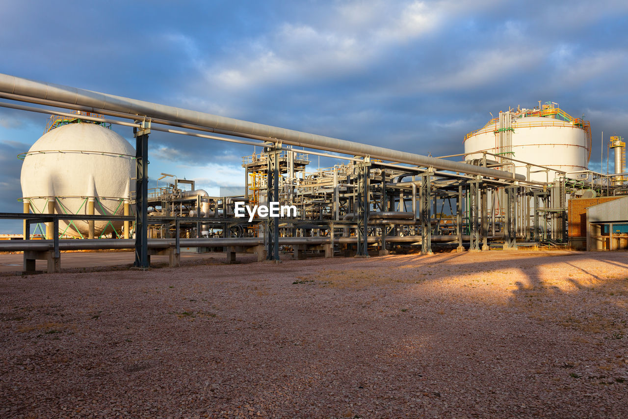 View of a gas refinery plant at sunset.