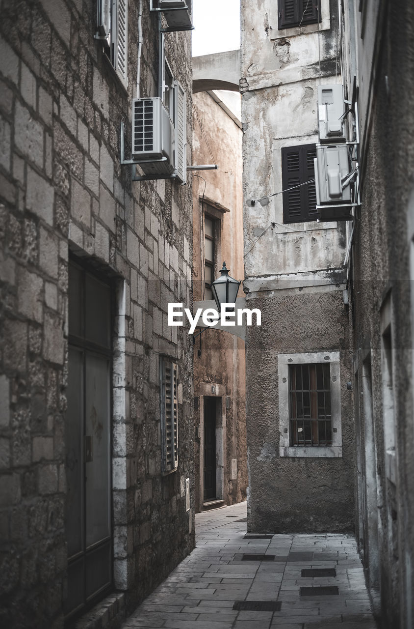 NARROW STREET AMIDST BUILDINGS