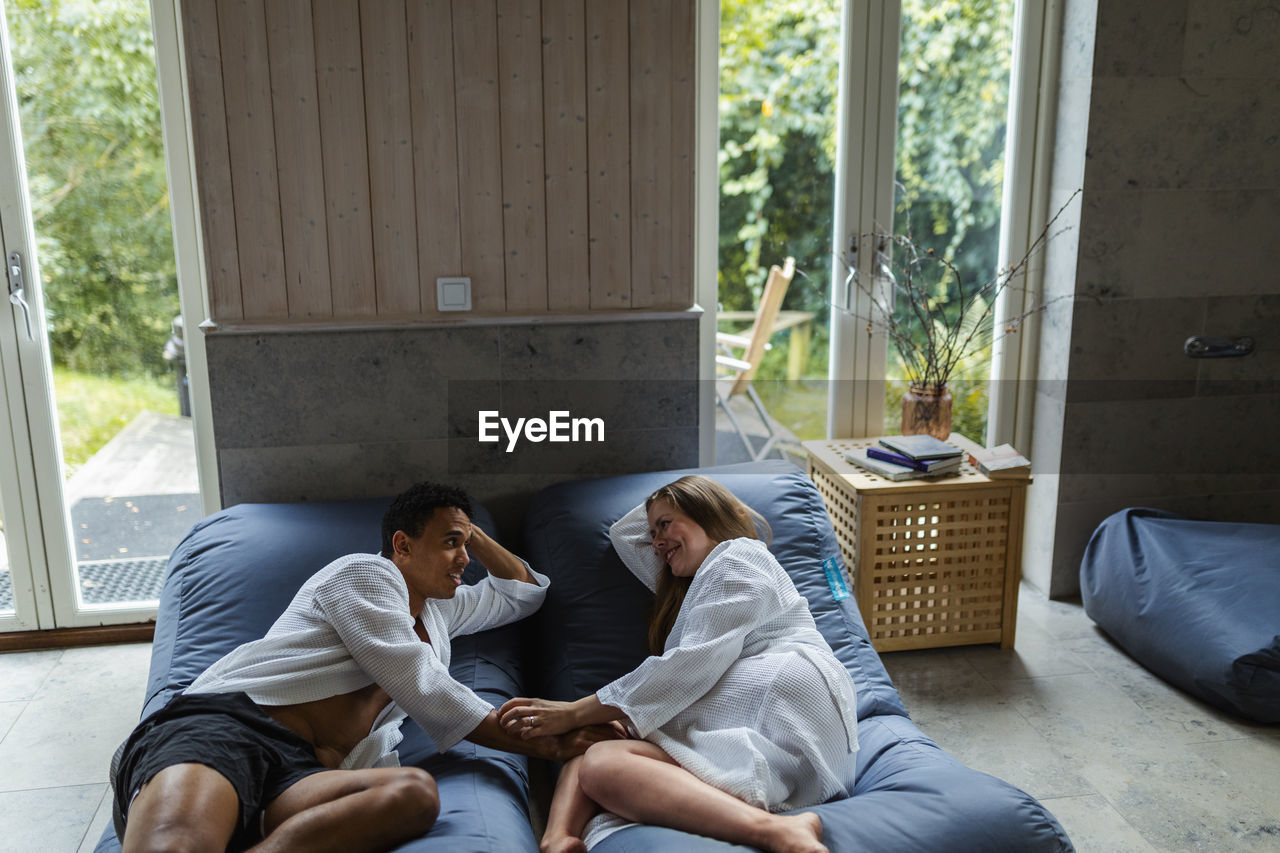 Couple relaxing together in living room