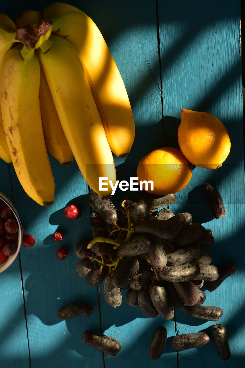 CLOSE-UP OF FRUITS ON TABLE