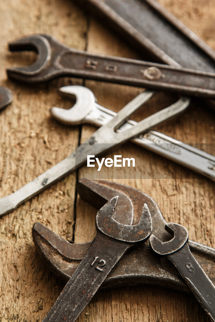 High angle view of work tools on wooden table