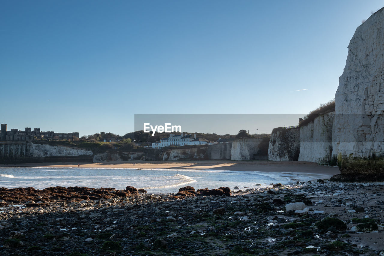 Scenic view of kingsgate bay, broadstairs, with cliffs and blue sky