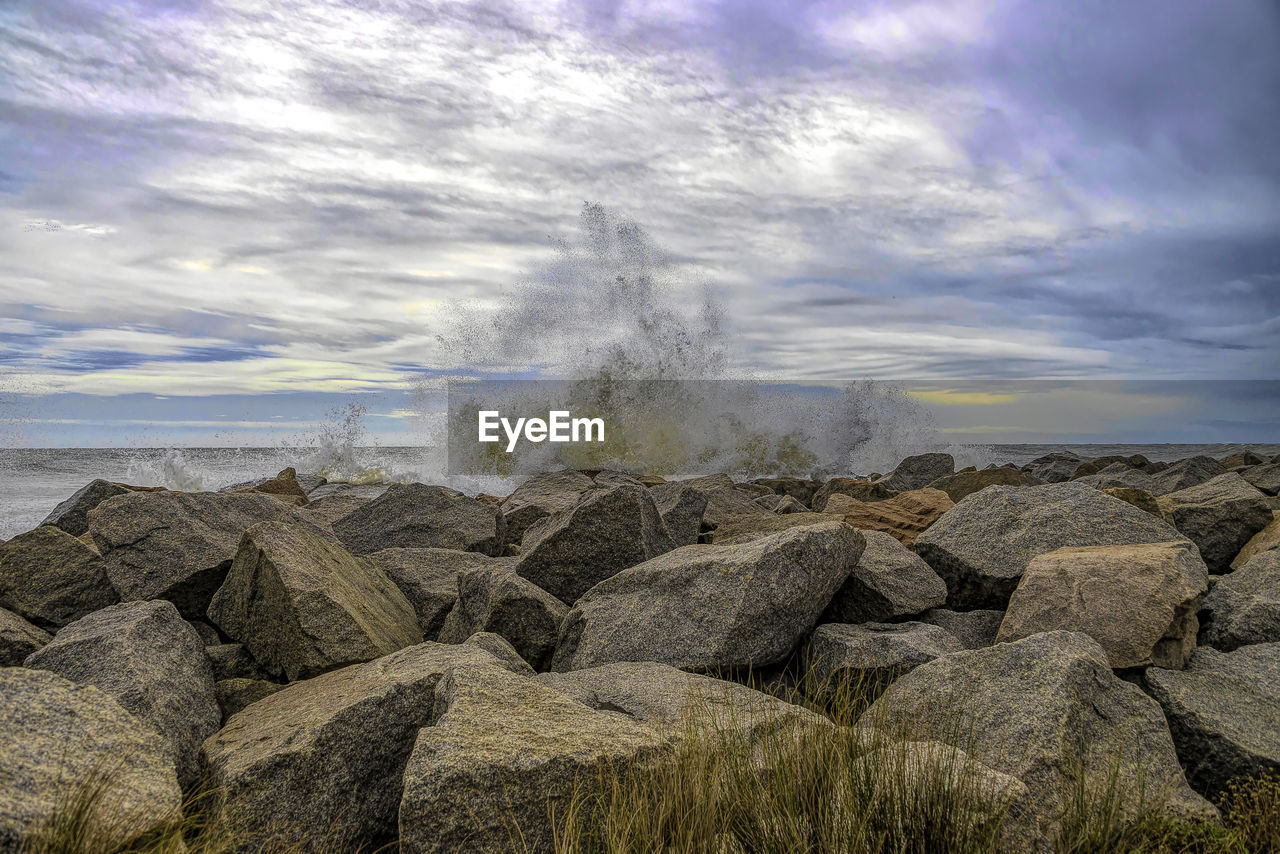 SCENIC VIEW OF ROCKS AGAINST SKY