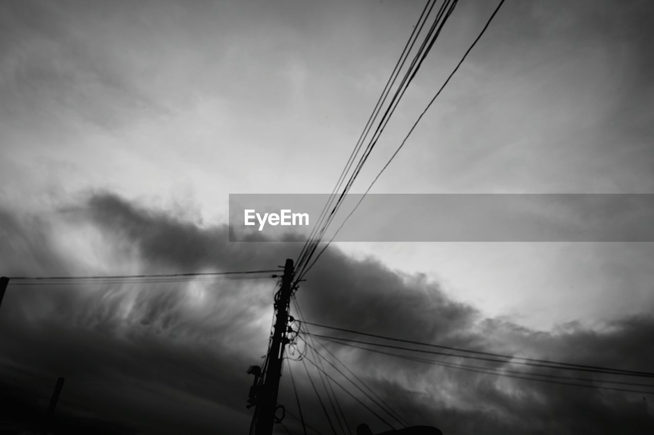 LOW ANGLE VIEW OF POWER LINES AGAINST SKY