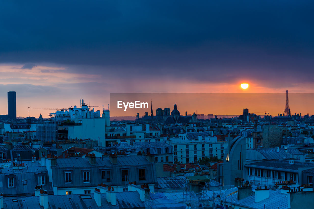 Cityscape against sky during sunset