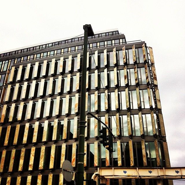 LOW ANGLE VIEW OF MODERN BUILDING AGAINST SKY