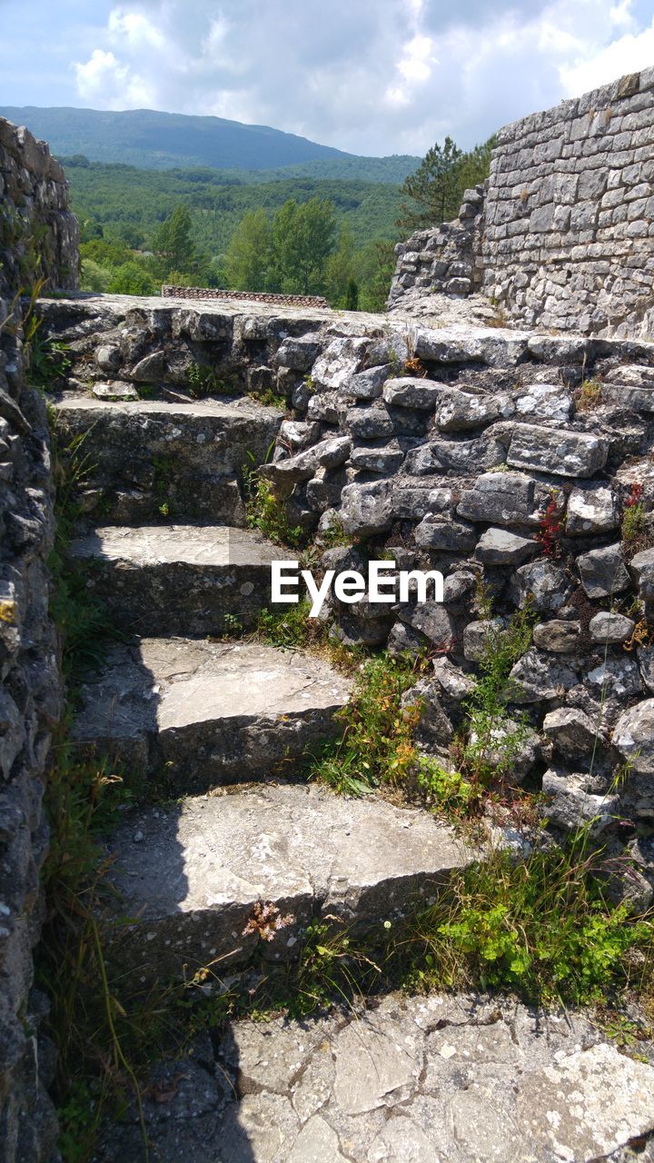 STEPS AND MOUNTAIN AGAINST SKY